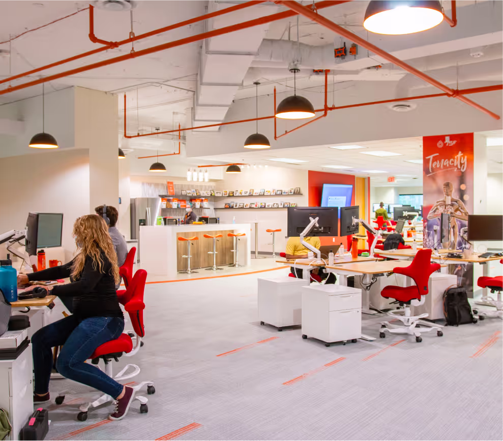 Open-plan office with people working at desks