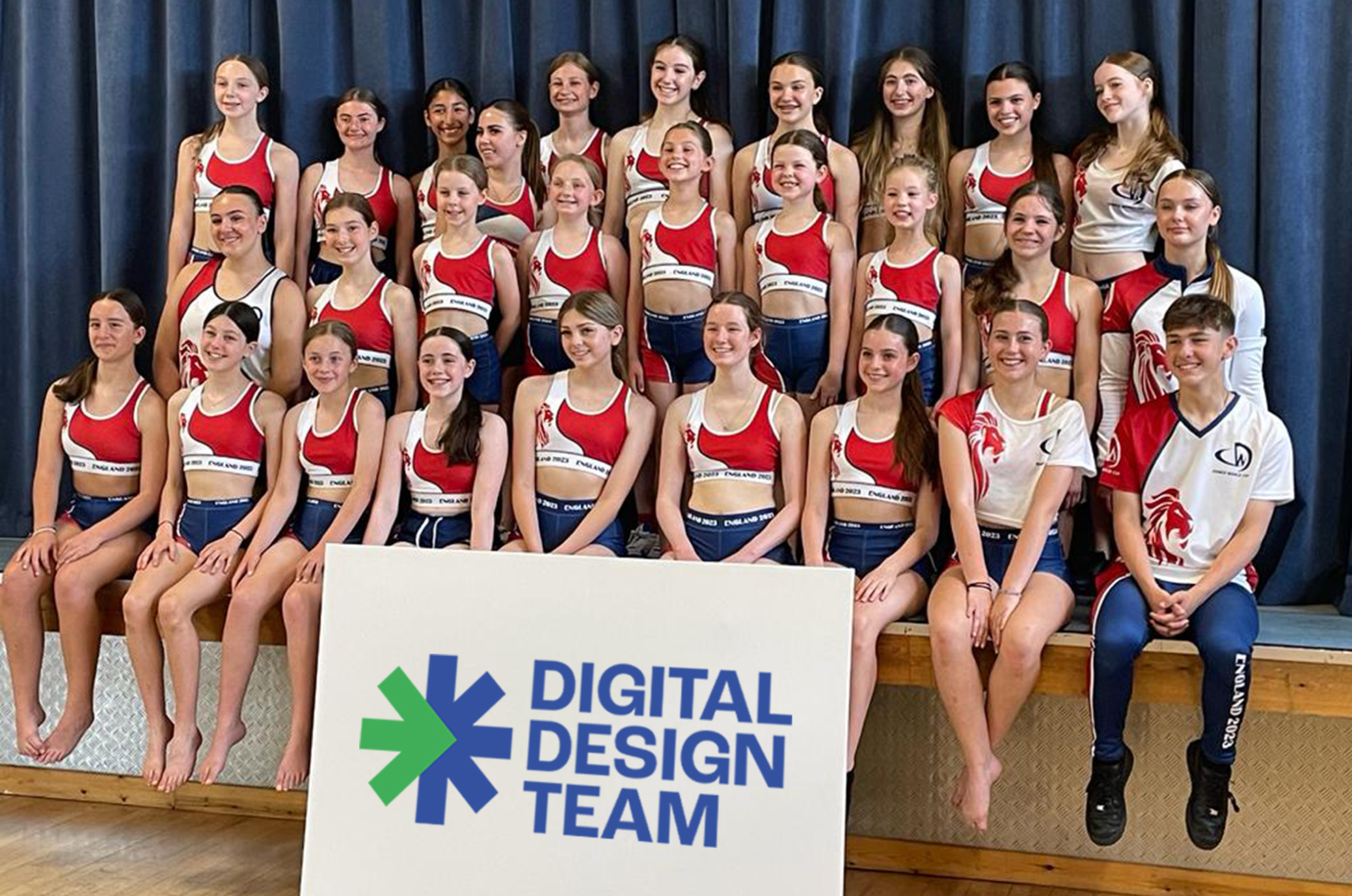 Allstars Academy dancers with a Digital Design Team sign